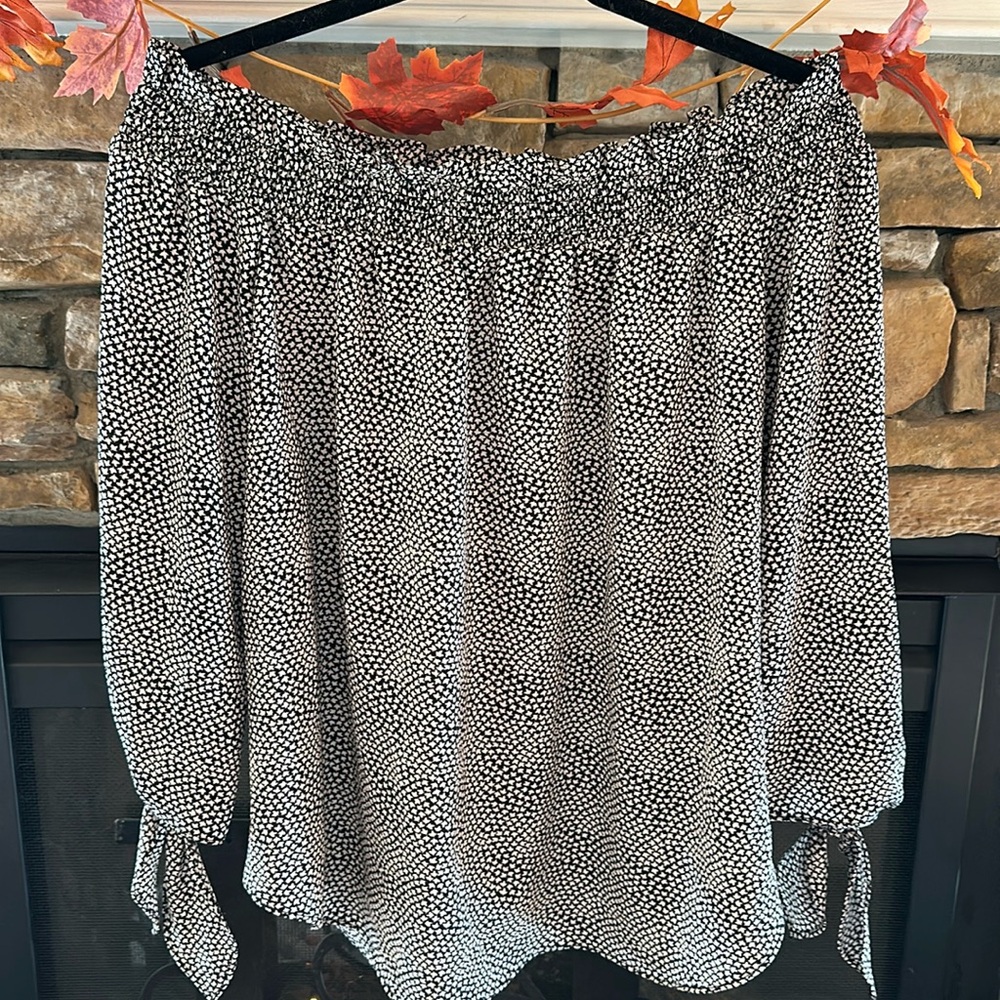 Beautiful black and cream patterned off the shoulder, silky blouse